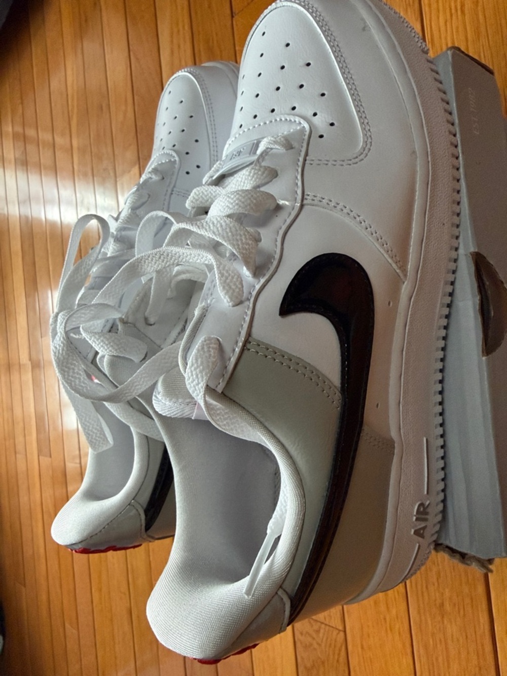 Nike Air Force 1 White Leather Sneakers with Black Swoosh